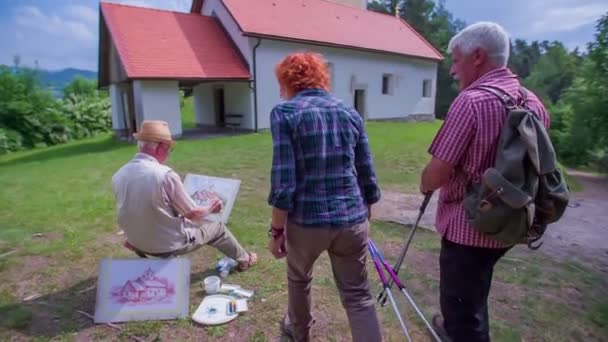 An artist and a senior couple meet - Footage, Video