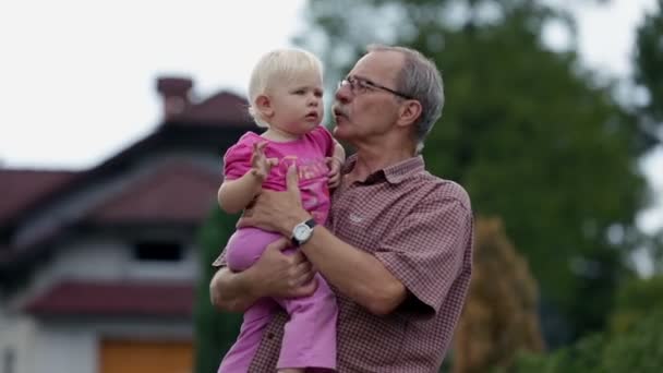 Grandfather playing with his grandchild - Footage, Video