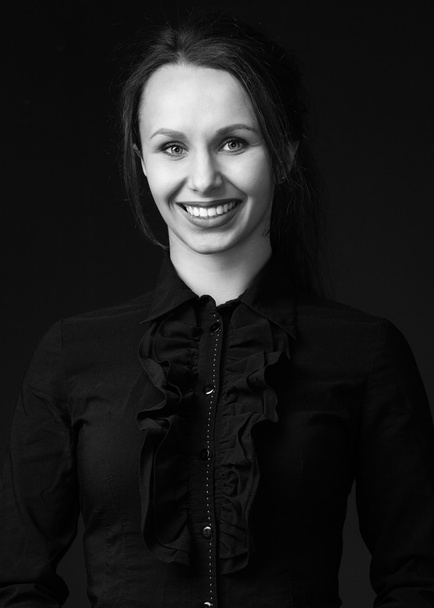 woman  in black shirt with bright lipstick and broad smile - Foto, immagini