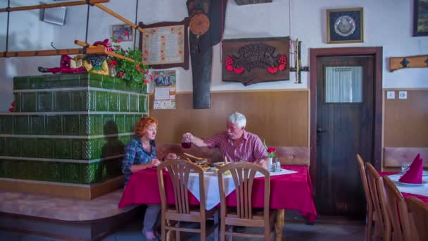 An older couple is dining out in a restaurant - Footage, Video