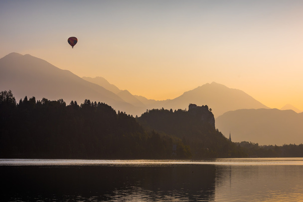 Silhouette of Bled Castle on a Lake - Photo, Image