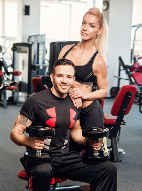 Gym woman exercising with her personal trainer - Photo, Image