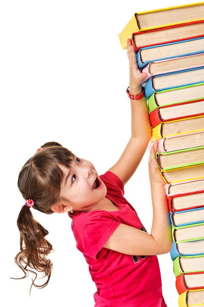 schoolmeisje met de dalende stapel boeken - Foto, afbeelding