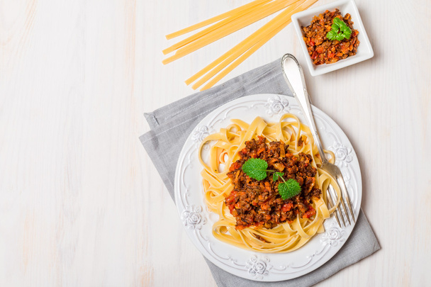 Spaghetti Bolognese on white plate - Fotó, kép