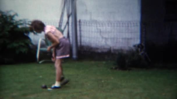 Girl playing croquet game in backyard  - Felvétel, videó