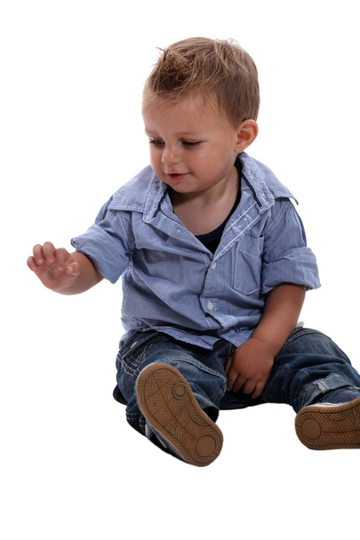Little boy looking at his hand - Foto, Bild