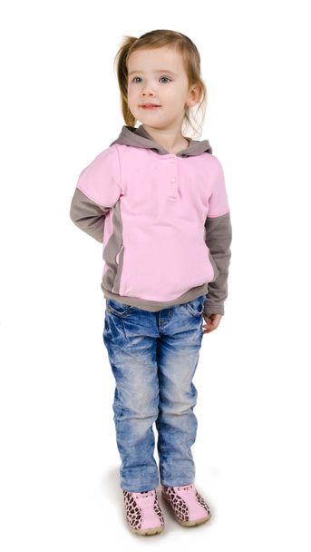 Portrait of smiling little girl in jeans - Φωτογραφία, εικόνα
