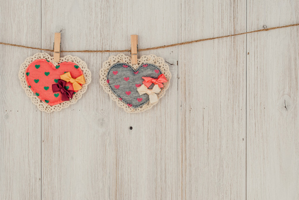 Heart hanging on the clothesline. On old wood background - Φωτογραφία, εικόνα