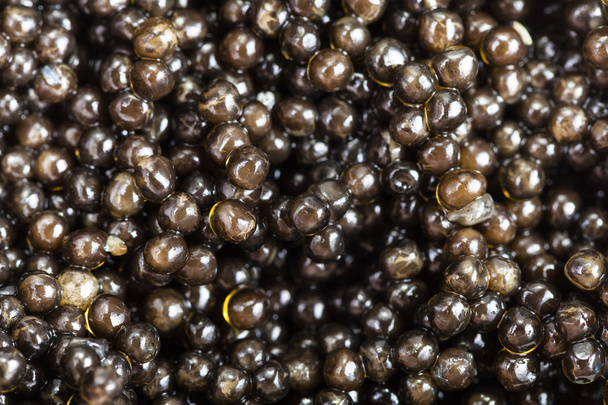 veel zwarte steur kaviaar close-up - Foto, afbeelding