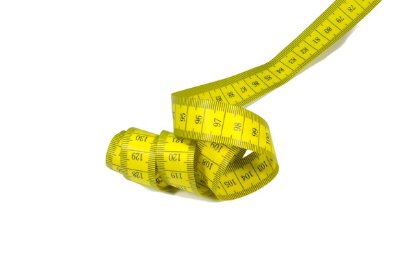 close-up shot of yellow measuring tape isolated on white - Photo, Image