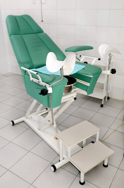 Female gynecological chair in the office of the doctor gynecologist - Foto, imagen