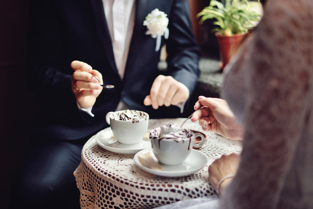 Emotional wedding couple in cafe having fun together. - Photo, Image