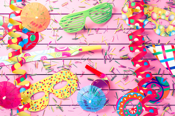 Colorful party decoration on pink background - Photo, image