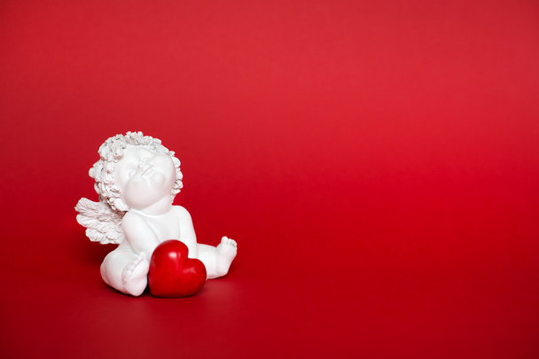 Little angel toy with heart - Foto, Imagen