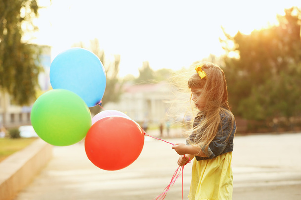 Little girl with balloons   - Valokuva, kuva