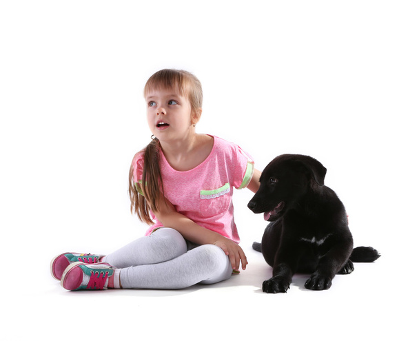 girl with puppy on white - Photo, image