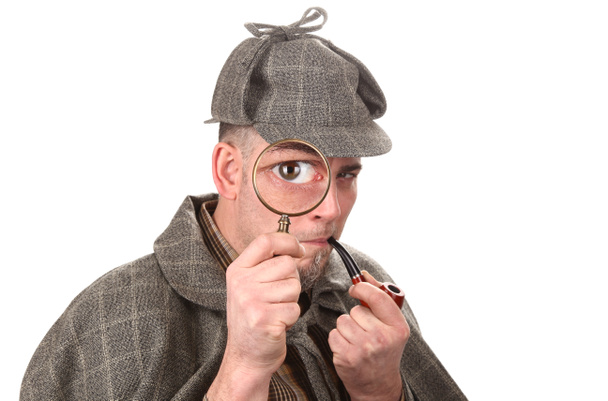 Detective looking through magnifying glass - Photo, Image
