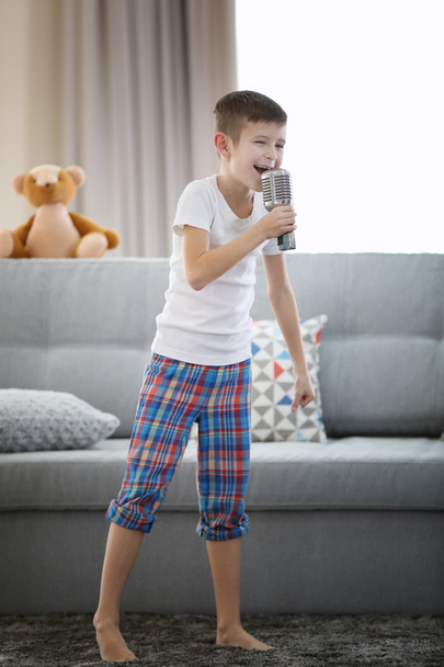 Little boy singing with microphone - Foto, Imagen