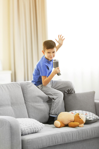Little boy singing with microphone  - Foto, Imagen