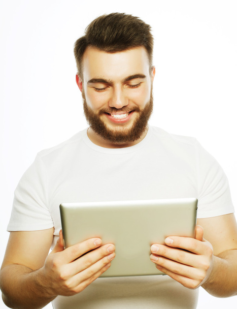 young man  using a tablet computer - Valokuva, kuva