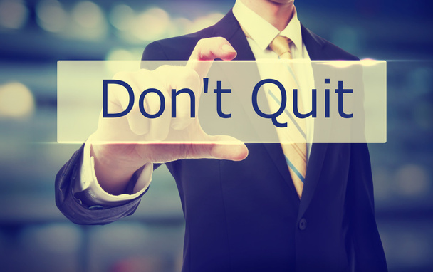 Business man holding Don't Quit - Photo, image