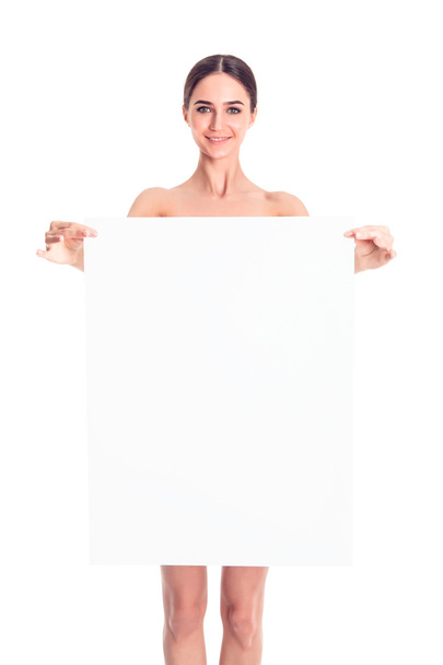 Sexy naked girl with a poster. Clean skin. Hair removed. Isolate. For advertising and presentation. - Foto, Imagem