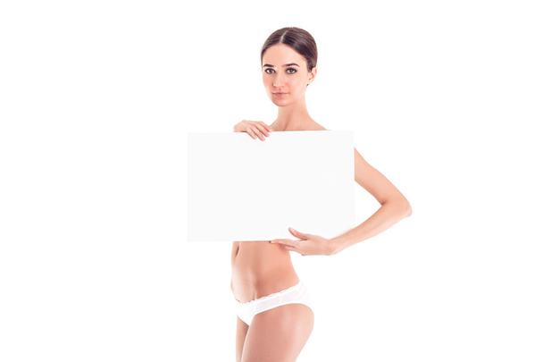 Sexy naked girl with a poster. Clean skin. Hair removed. Isolate. For advertising and presentation. - Fotografie, Obrázek