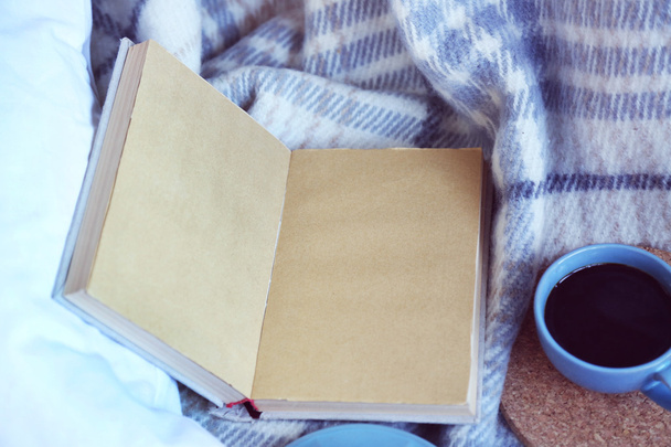 Open book, plaid and coffee - 写真・画像