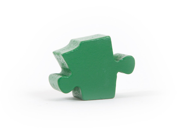 Closeup of big green jigsaw puzzle piece - Photo, Image