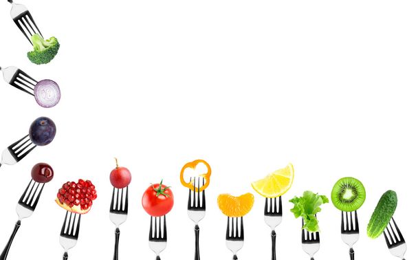 Fruits and vegetables on fork - Foto, Bild