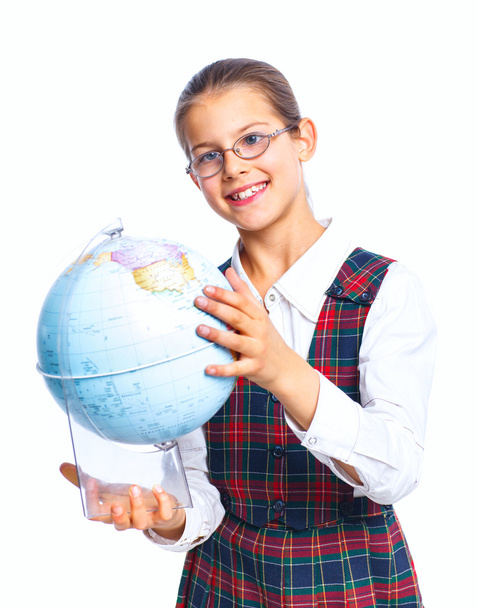 Schoolgirl with a globe - Фото, изображение