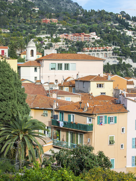VILLEFRANCHE-SUR-MER, FRANCE, on JANUARY 8, 2016. Houses on a mountain slope. Architectural details. - Zdjęcie, obraz