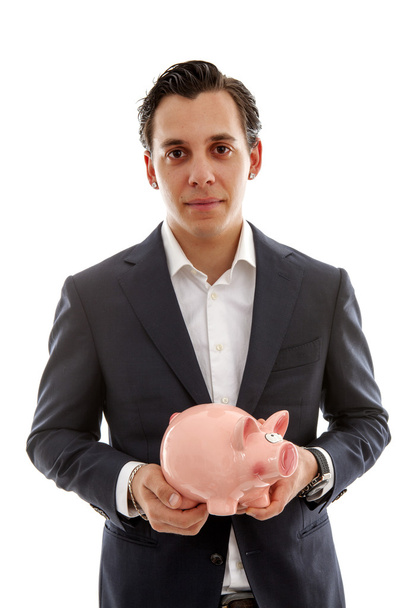 Zakenman houdt piggy bank - Foto, afbeelding