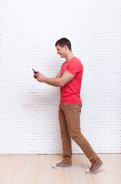 Man Going Using Cell Phone Smartphone Social Network Communication - Foto, Imagem