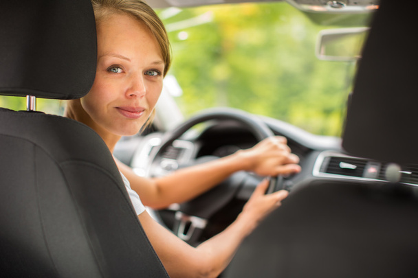 Young woman driving her car - Фото, изображение