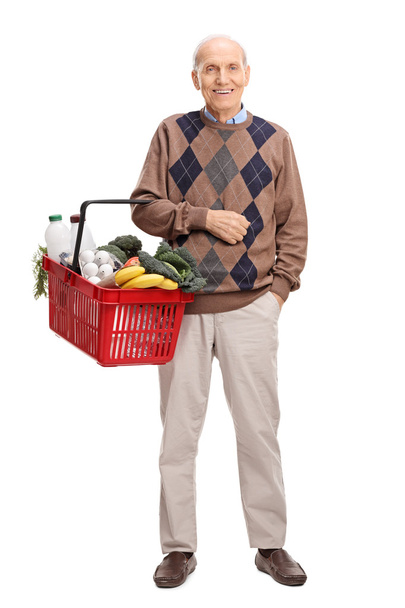 senior man holding a shopping basket - Foto, Imagem