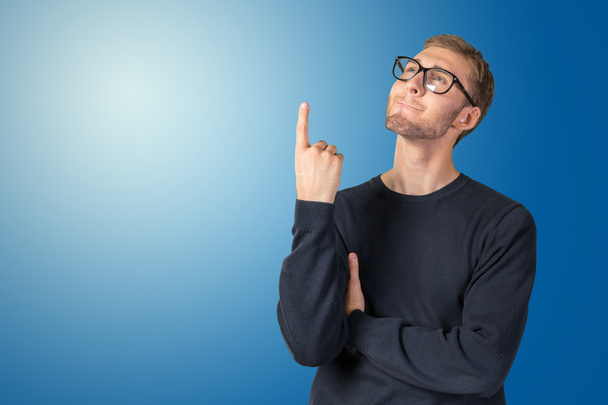 Man in glasses pointing up - Photo, image