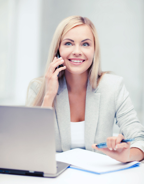 businesswoman with laptop and cell phone - Foto, Imagen