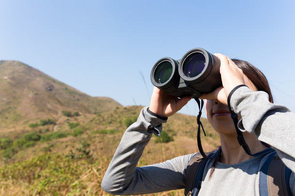 female tourist looking through binoculars - Photo, Image