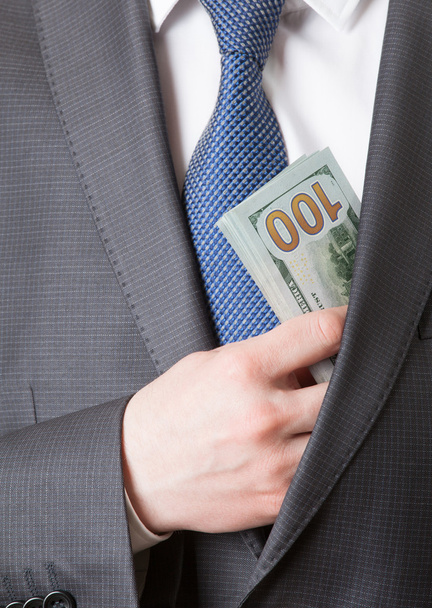 Businessman holding dollars - Foto, Bild