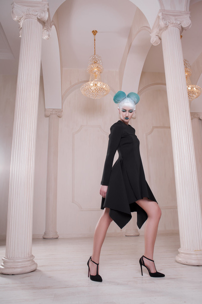 creative and futuristic look of fashion woman in beautiful white hall baroque with columns - Photo, Image