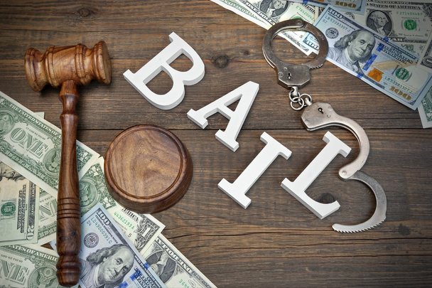 Gavel, Sign BAIL, Handcuffs And Dollar Cash On Wood Background - Foto, afbeelding