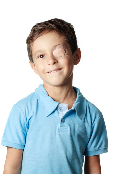 Child with eye patch isolated on white background - Фото, изображение