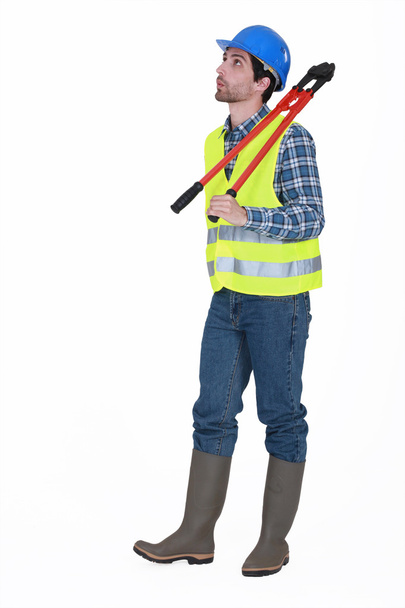 Manual worker holding bolt-cutters - Фото, зображення