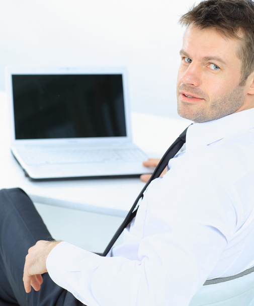 Portrait of handsome young business man and laptop - Photo, image