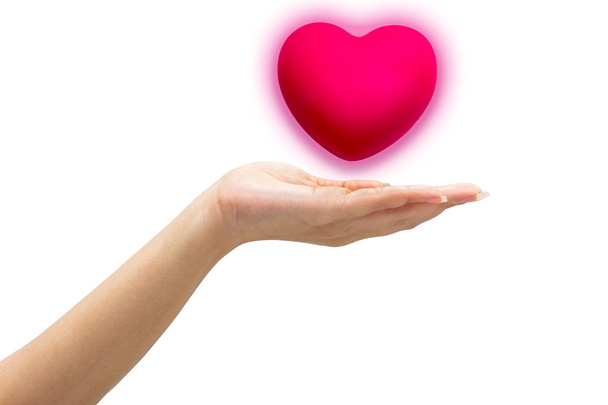 розовое сердце в руках человека, изолированные на белом фоне
. - Фото, изображение