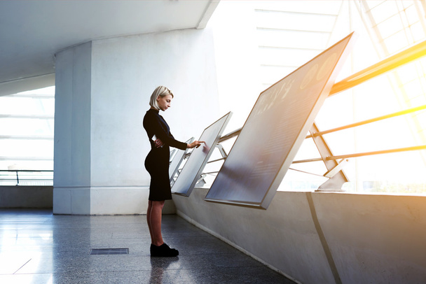 Young businesswoman using interactive display - 写真・画像