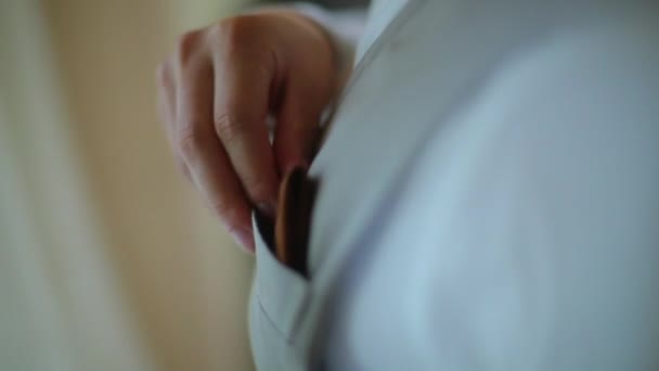 The guy puts the handkerchief in his pocket vest - Filmati, video