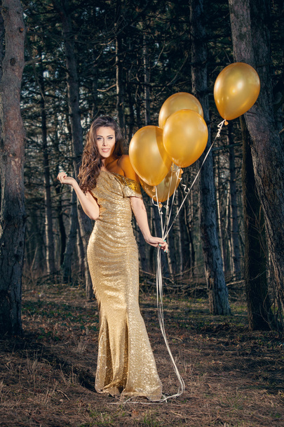 elegant woman with balloons in wood - Photo, Image