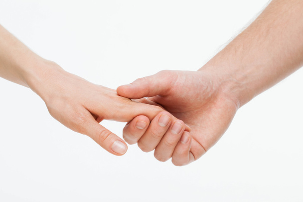 Man's hand gently holding woman's hand  - Foto, Bild